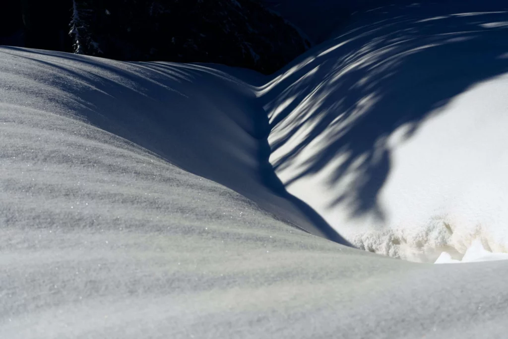 Fresh alpine snowdrifts and winter shadows in the French Alps for Les Carroz Transfers