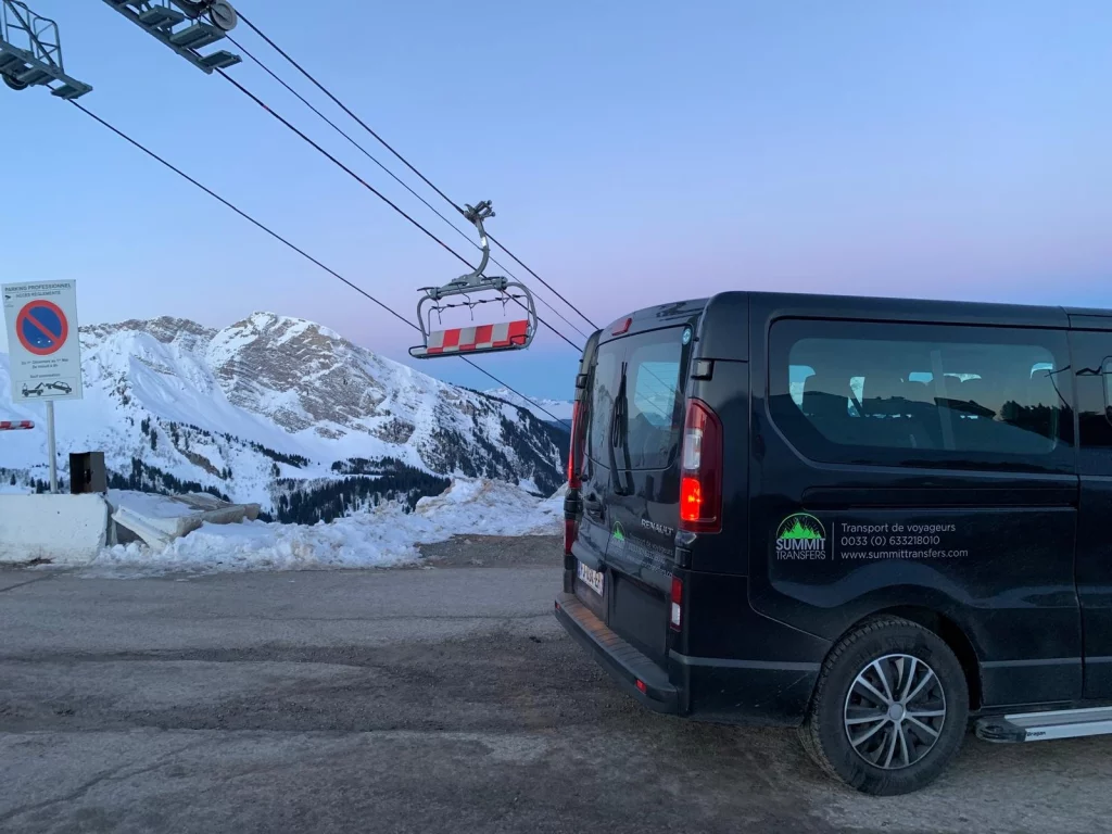 Summit Transfers vehicle parked in snowy alpine scenery for private transfers from Geneva to Avoriaz